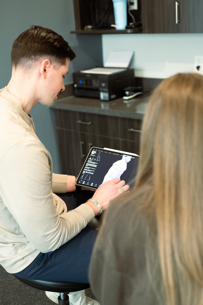 Devin Wittow educating a client during assessment